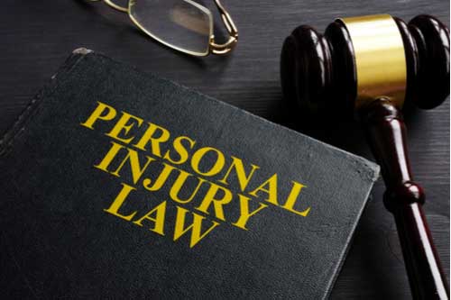 Atlanta personal injury lawyer concept personal injury law book and judge gavel