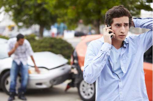 Smyrna car accident lawyer concept driver on phone after crash